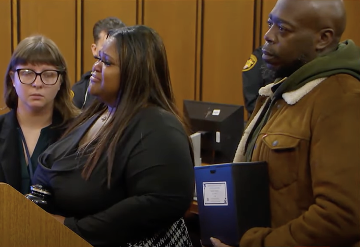 Seaerra LeFlore holds the remains of her son Braylon Hardges in an urn at the sentencing for her son